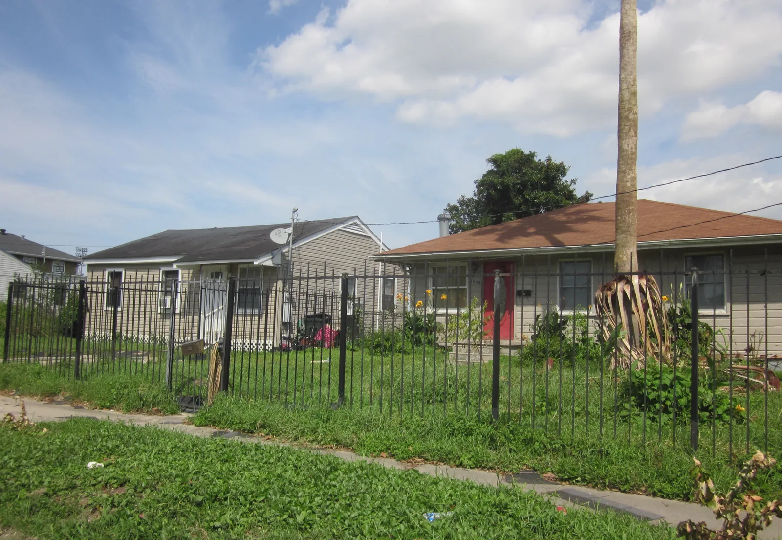 House roof with shingles torn off by hurricane winds